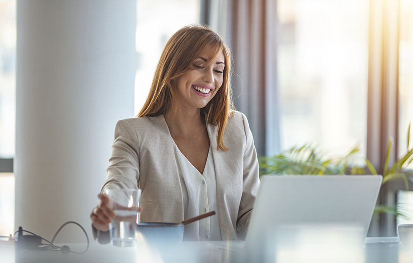 Confident young caucasian woman working from home office.