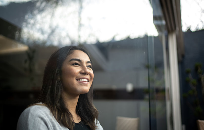 Young woman contemplating at home