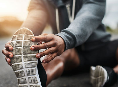 Person stretching shoe